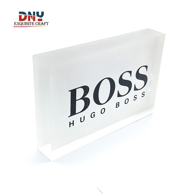 Factory custom transparent acrylic logo block All white back silk screen with black lettering Clothing retail store branddisplay